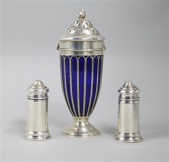 An Edwardian silver mounted blue glass sugar shaker and an early 20th century Australian silver salt & pepper by W. J. Saunders.